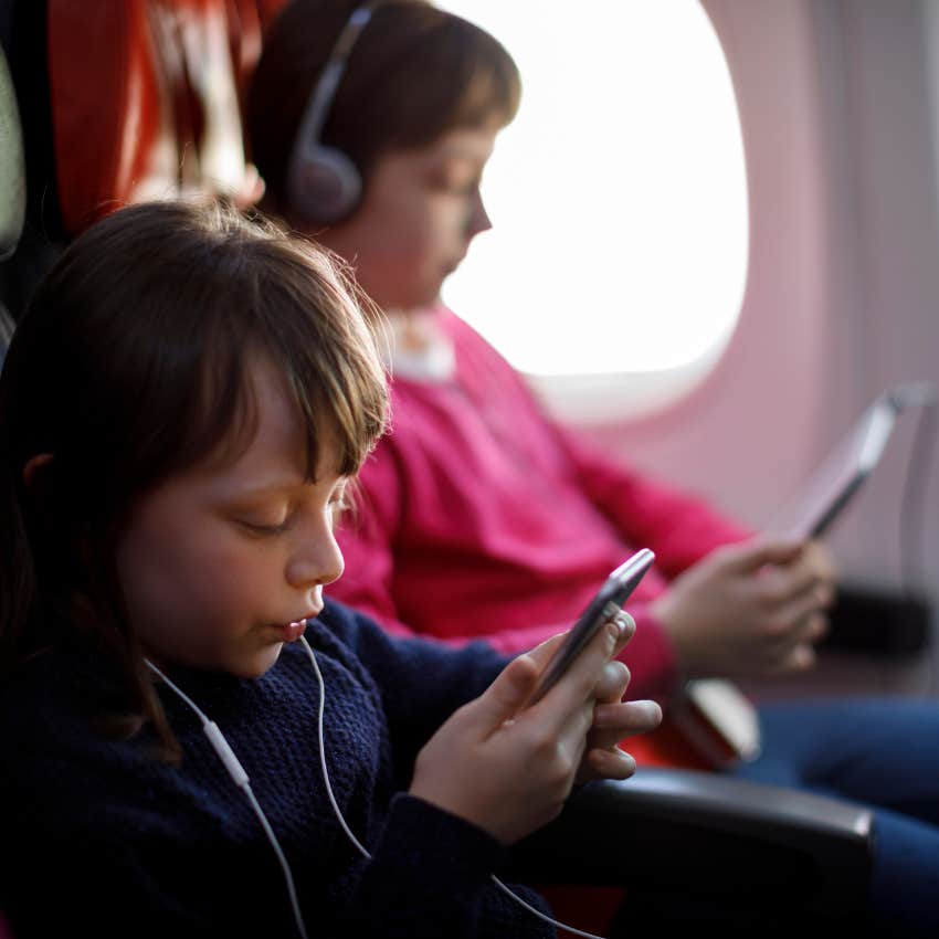 mom struggles to care for her kids on a plane while her husband relaxes