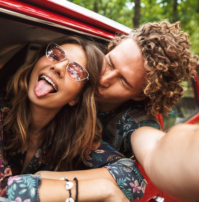 happy couple out for a fun drive in car